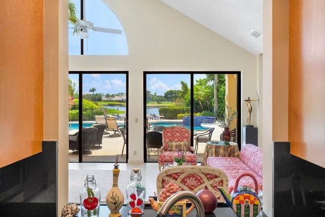 a bedroom with two beds and a large window