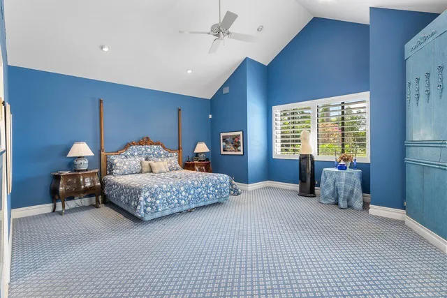 a bathroom with a granite countertop sink a toilet and a mirror