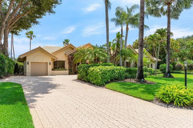 an aerial view of a house with outdoor space and street view