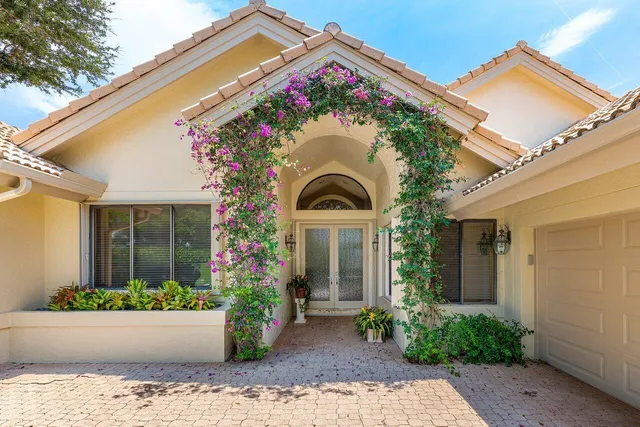 an aerial view of a house with a swimming pool