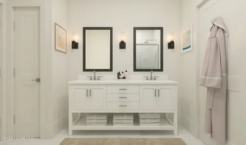 a bathroom with a sink double vanity and a mirror