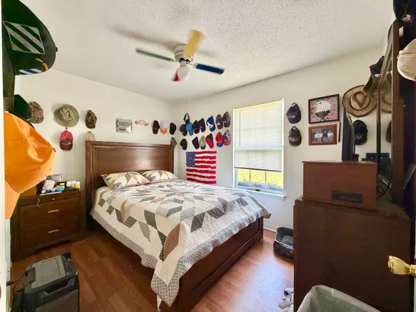 a bedroom with a bed and a couch
