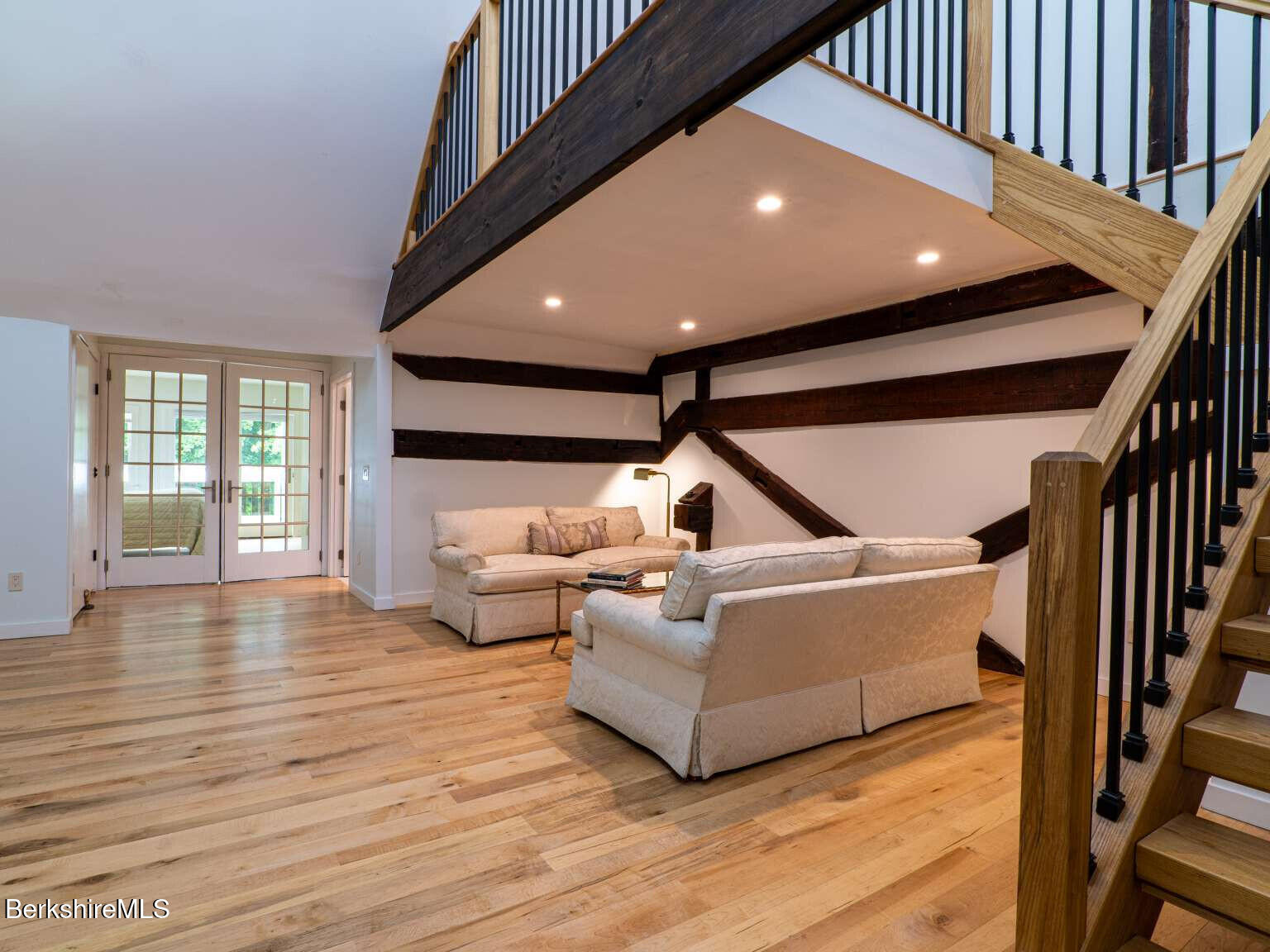 160 High Street Lee, MA 01238 - Photo 34 of 41 a living room with furniture floor to ceiling window and wooden floor