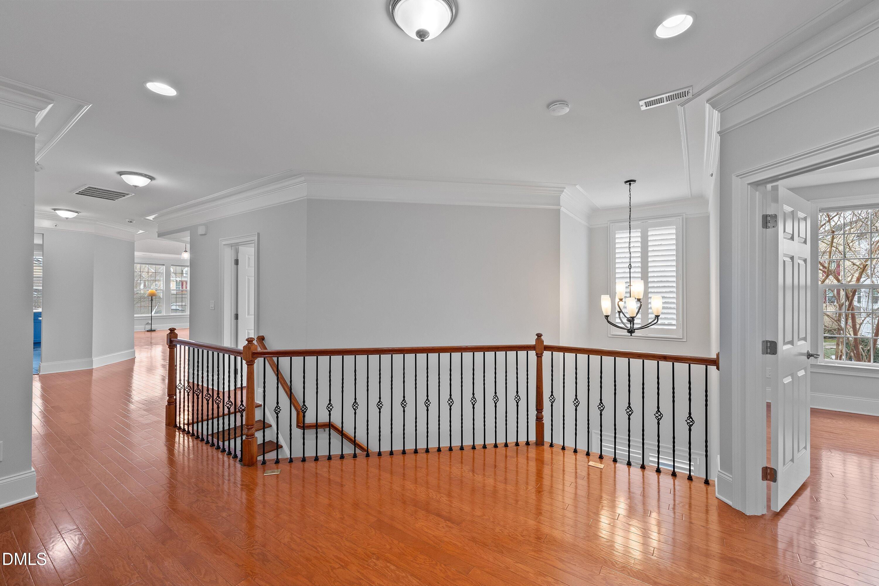 9211 Calabria Drive, Unit 205 Raleigh, NC 27617 - Photo 3 of 55 a view of hallway with wooden floor