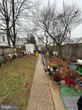 a view of a yard with cars