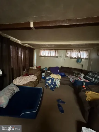 a bed room with gym equipment and a chandelier