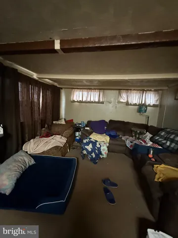 a bed room with gym equipment and a chandelier