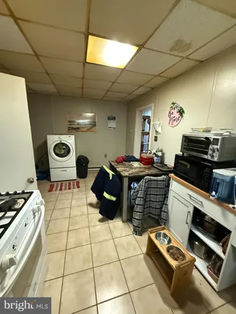a kitchen with a stove and a microwave