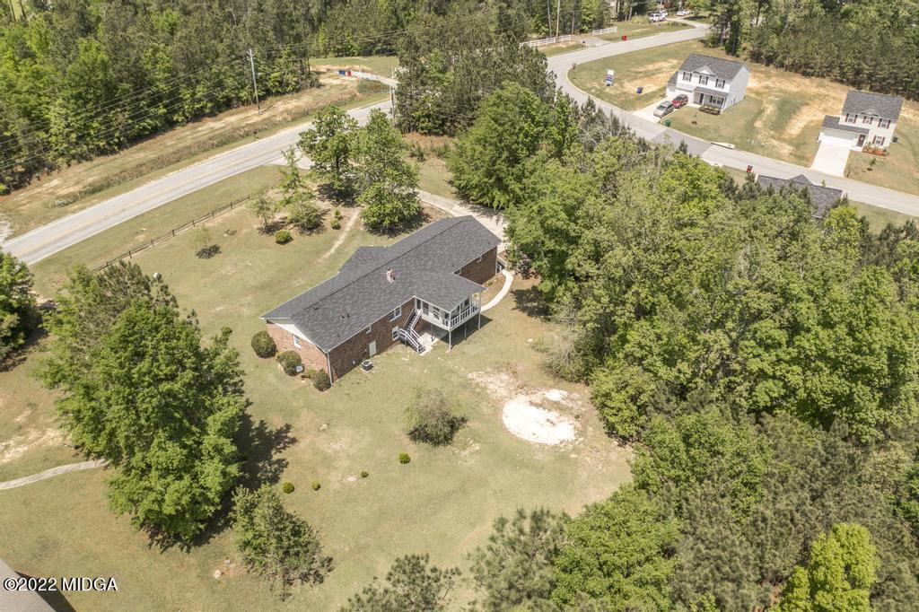 2554 Pineworth Road Macon, GA 31216 - Photo 54 of 56 an aerial view of a house with a yard and lake view