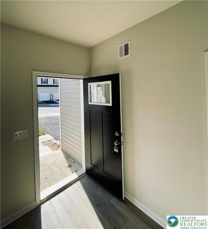 318 Barber Street, Unit LOT 33 Allentown, PA 18103 - Photo 16 of 53 a view of a hallway with wooden floor and stairs