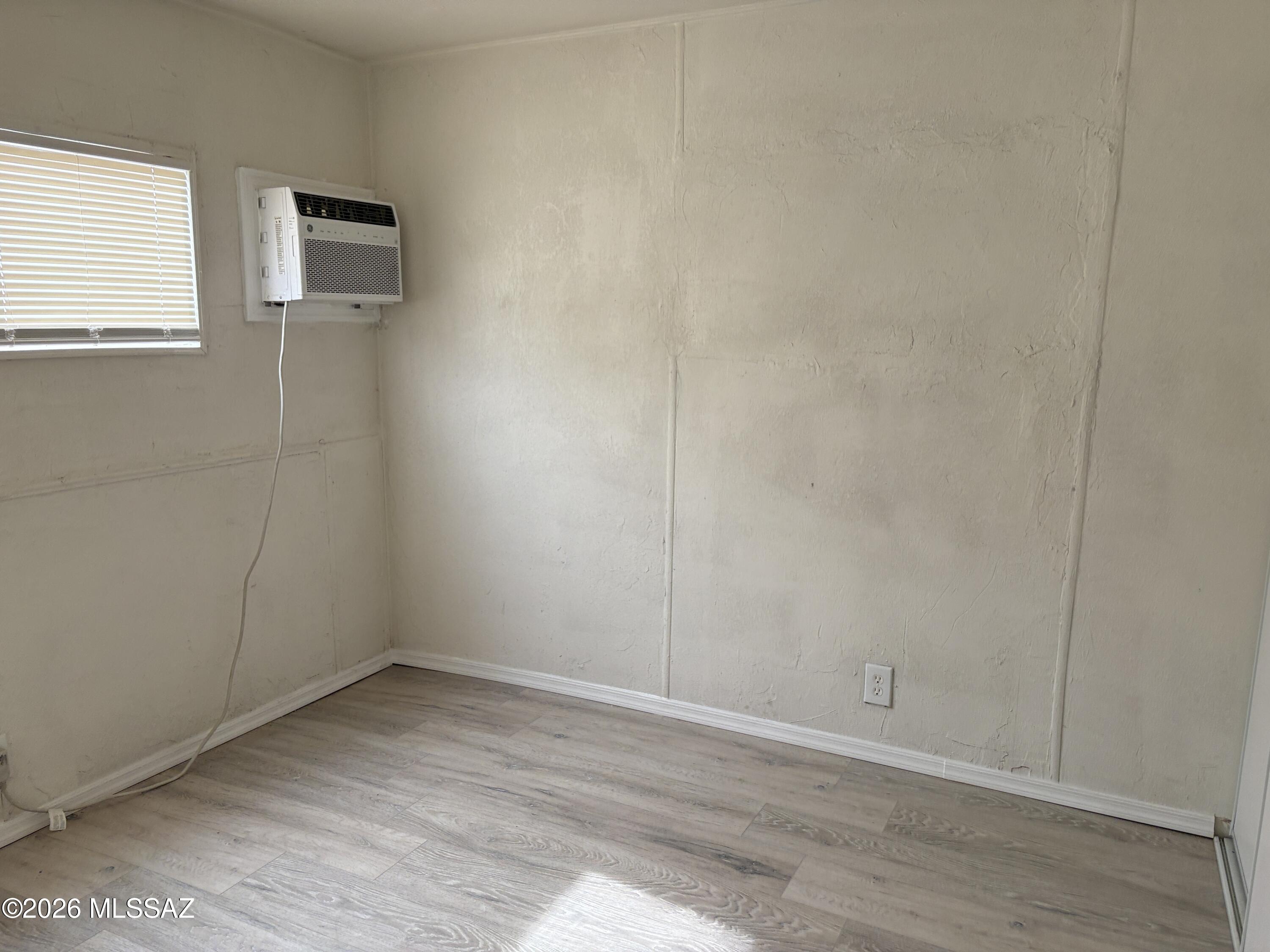1741 West Wetmore Road, Unit 17 Tucson, AZ 85705 - Photo 8 of 9 wooden floor in an empty room