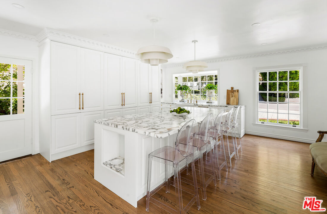 949 Stone Canyon Road Los Angeles, CA 90077 - Photo 13 of 41 a view of a kitchen with kitchen island and a window