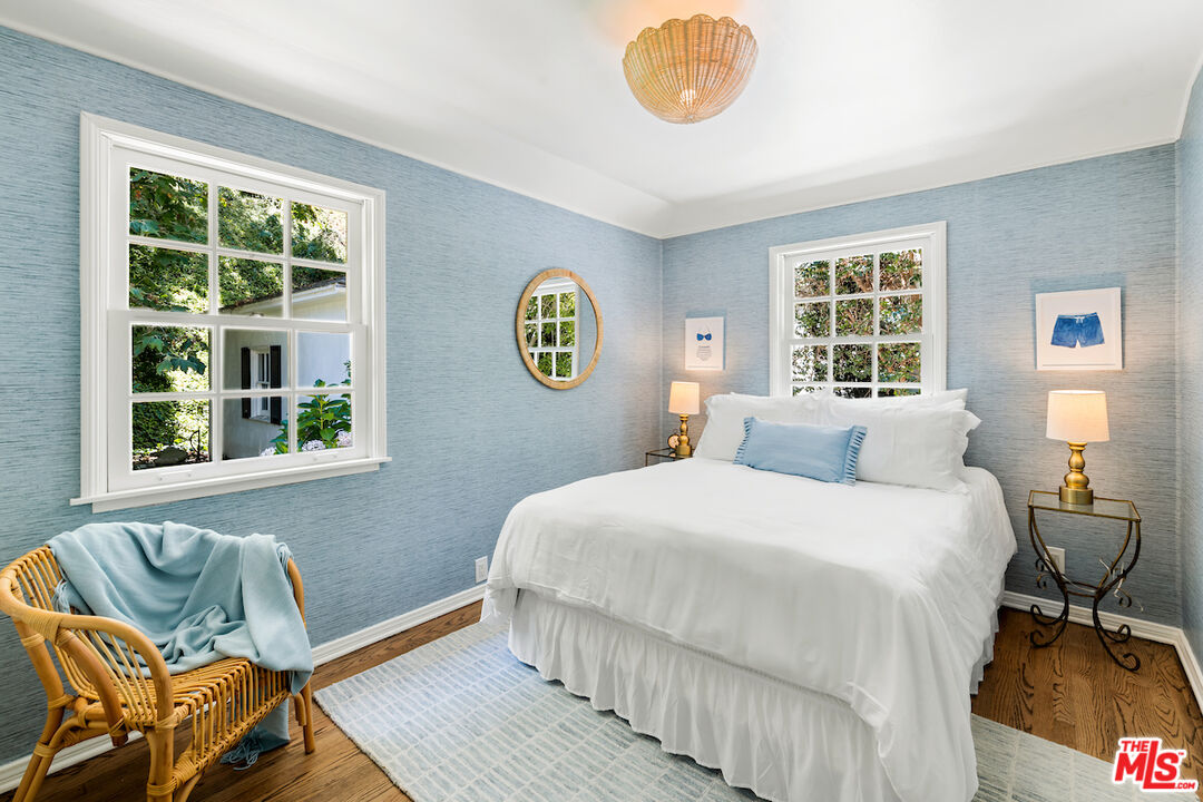 949 Stone Canyon Road Los Angeles, CA 90077 - Photo 17 of 41 a bedroom with a bed and a window