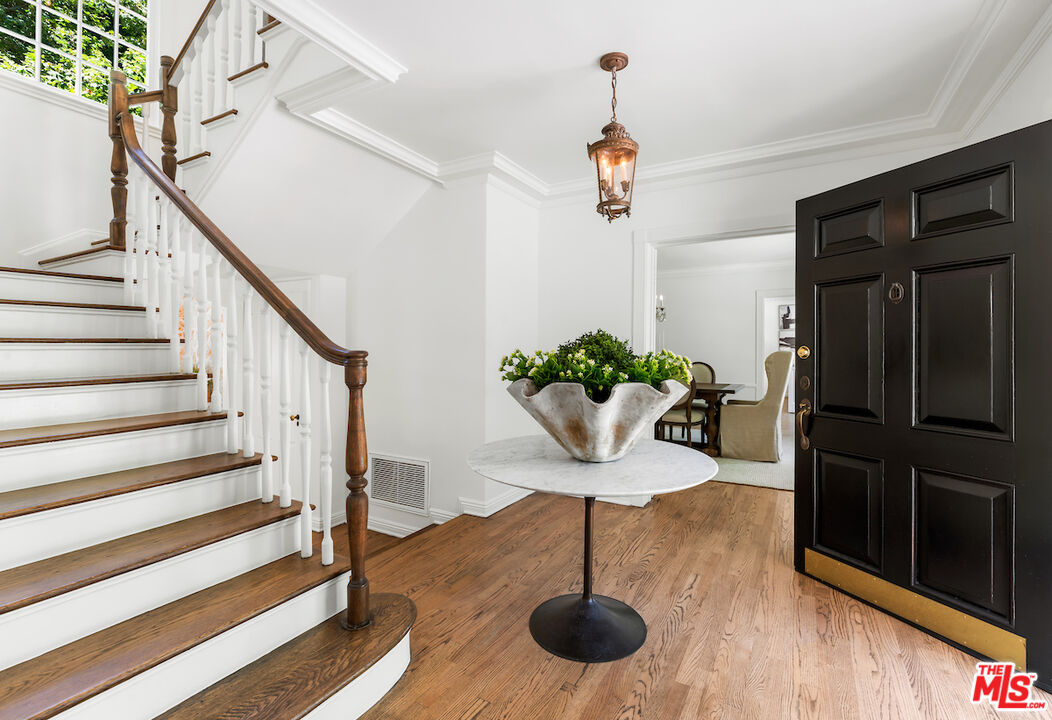 949 Stone Canyon Road Los Angeles, CA 90077 - Photo 5 of 41 a view of entryway and hall with wooden floor