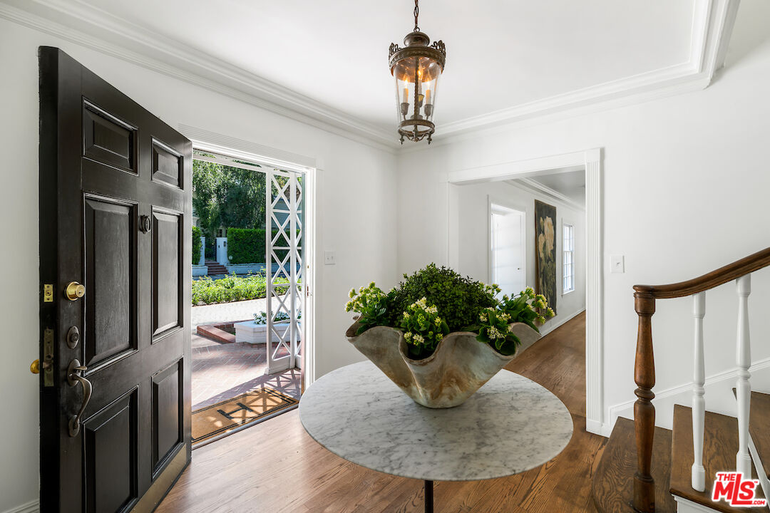 949 Stone Canyon Road Los Angeles, CA 90077 - Photo 6 of 41 a view of a dining room with furniture window and wooden floor