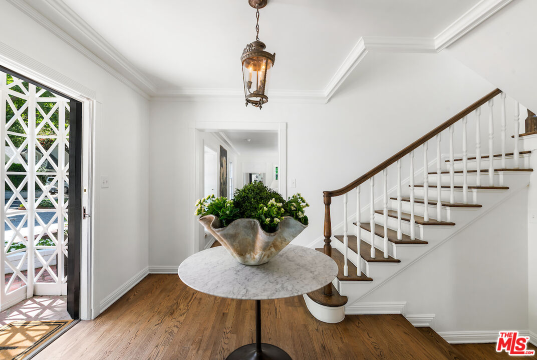 949 Stone Canyon Road Los Angeles, CA 90077 - Photo 7 of 41 a view of entryway and hall with wooden floor