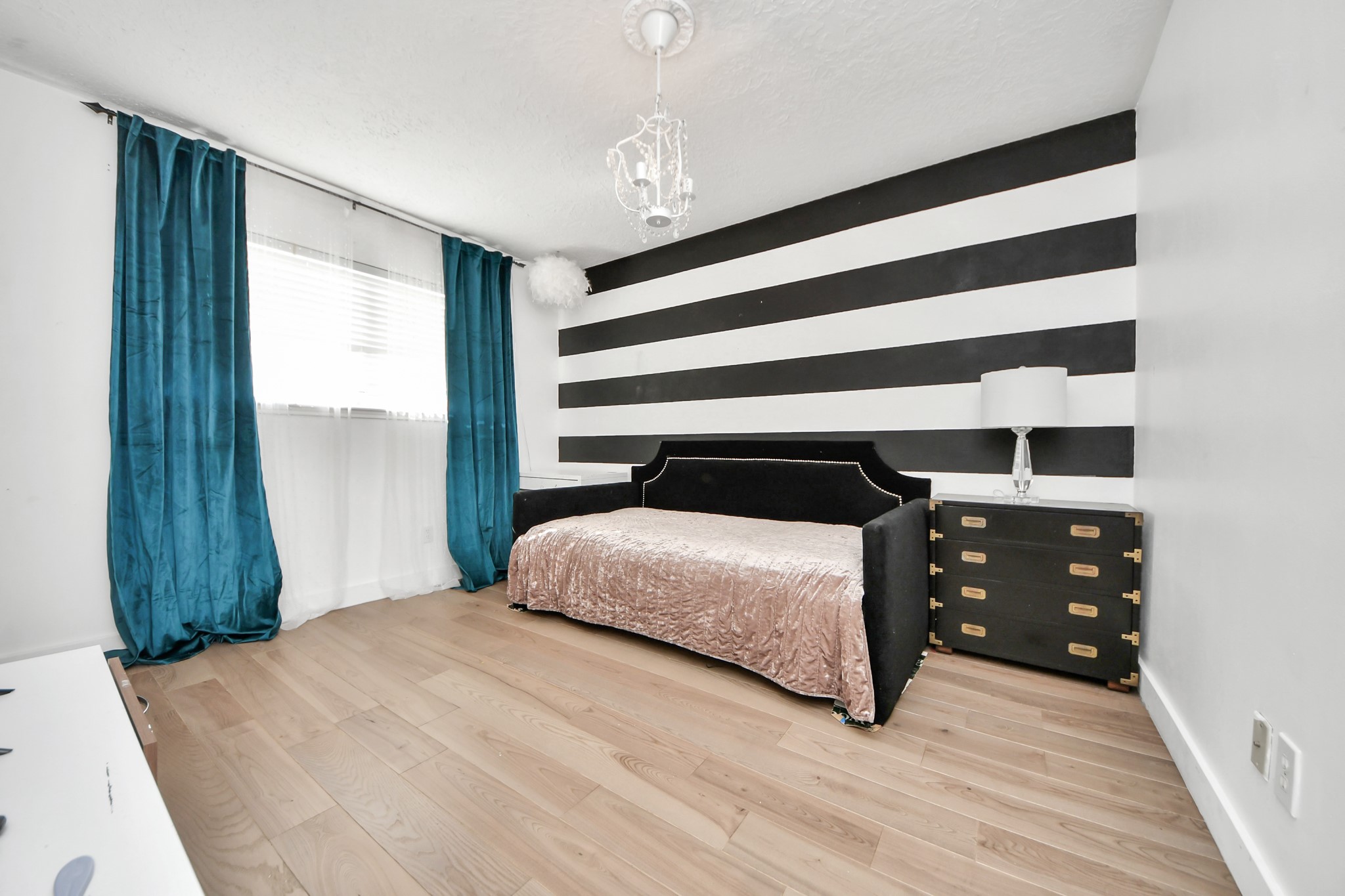 15015 Margeson Street Houston, TX 77084 - Photo 15 of 21 a bedroom with a bed and a window