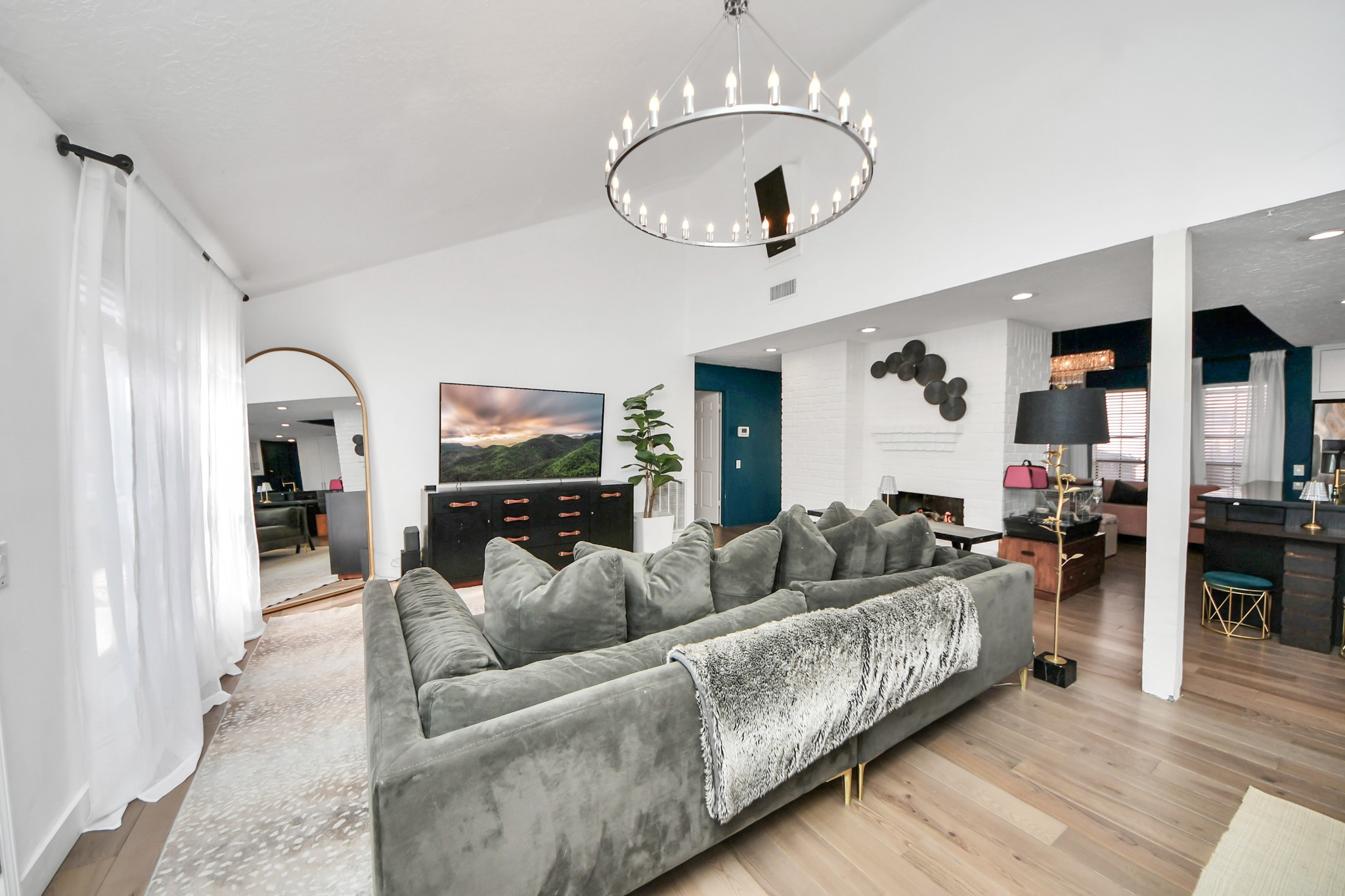 15015 Margeson Street Houston, TX 77084 - Photo 9 of 21 a living room with furniture kitchen and a chandelier