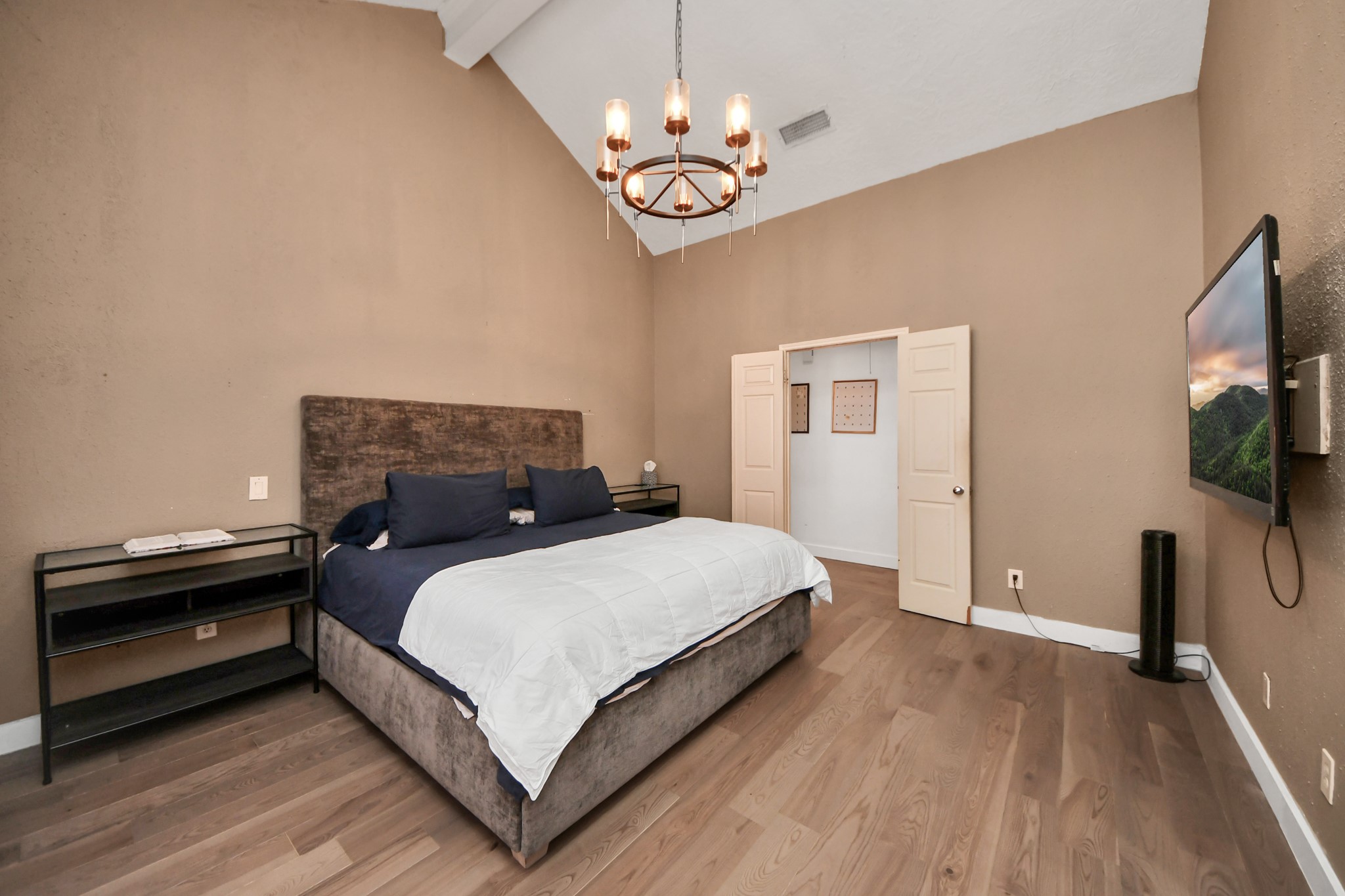 15015 Margeson Street Houston, TX 77084 - Photo 10 of 21 a bedroom with a bed and a flat tv screen on a dresser