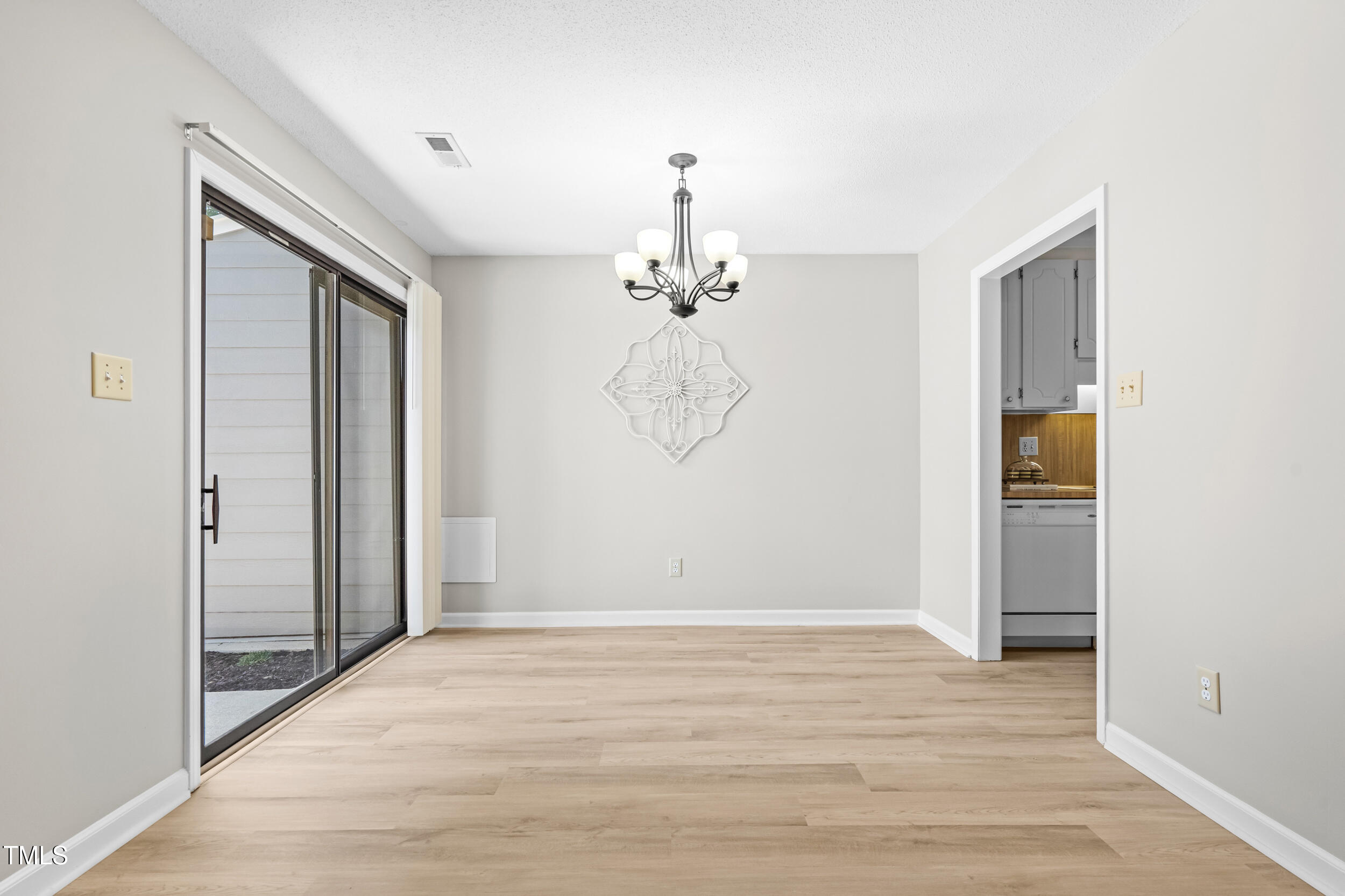232 Clancy Circle Cary, NC 27511 - Photo 4 of 14 a view of a chandelier in a room