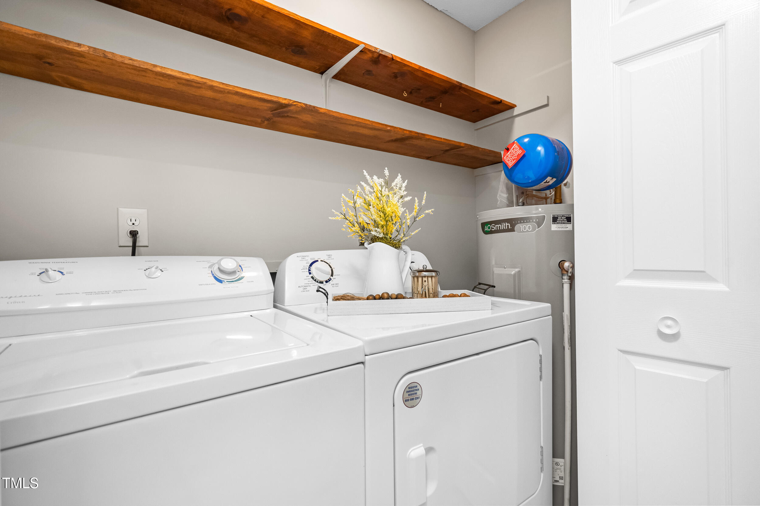 232 Clancy Circle Cary, NC 27511 - Photo 9 of 14 a utility room with dryer and washer