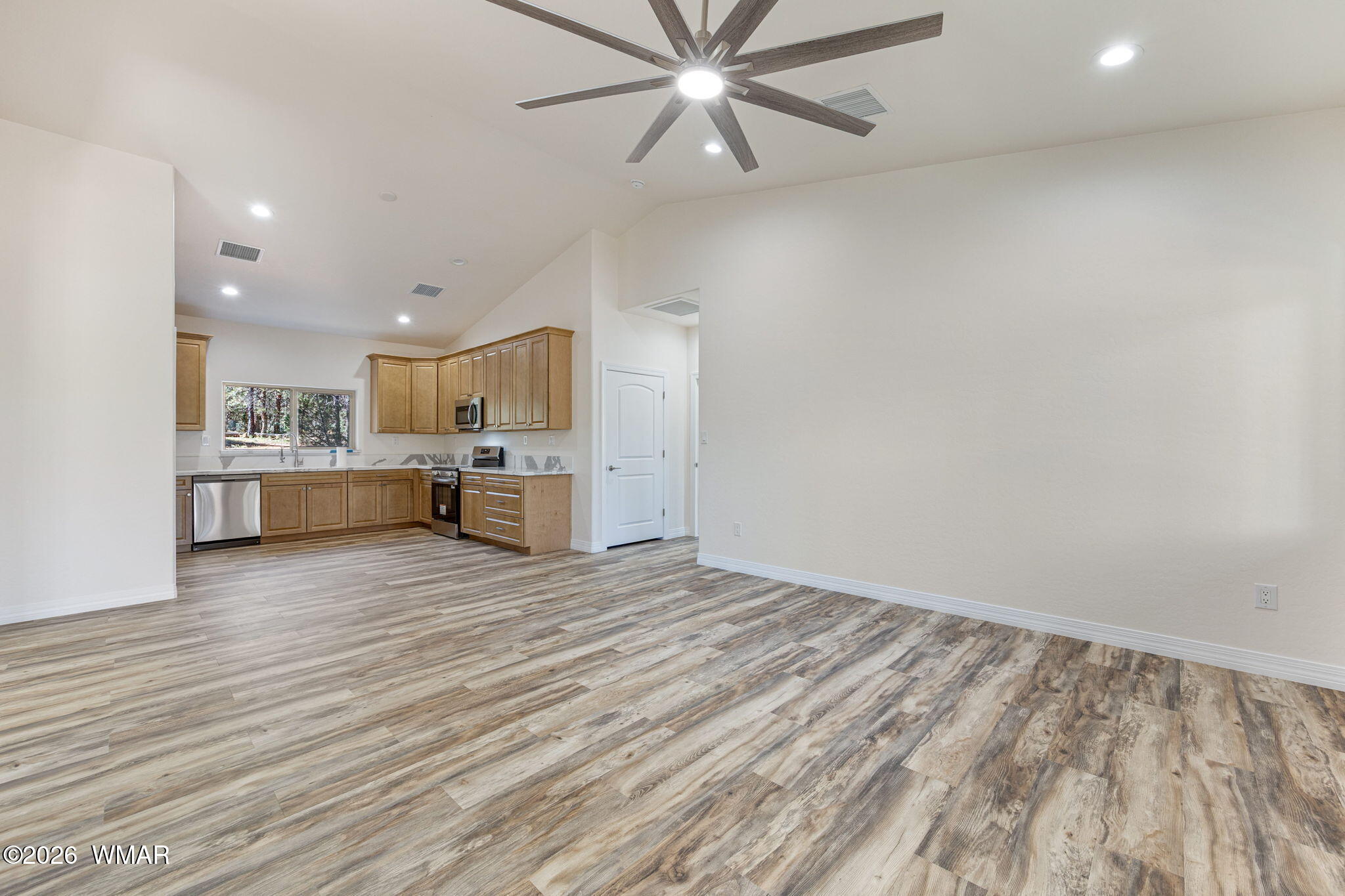 2273 Constellation Lane Overgaard, AZ 85933 - Photo 8 of 31 a view of kitchen and kitchen with wooden floor