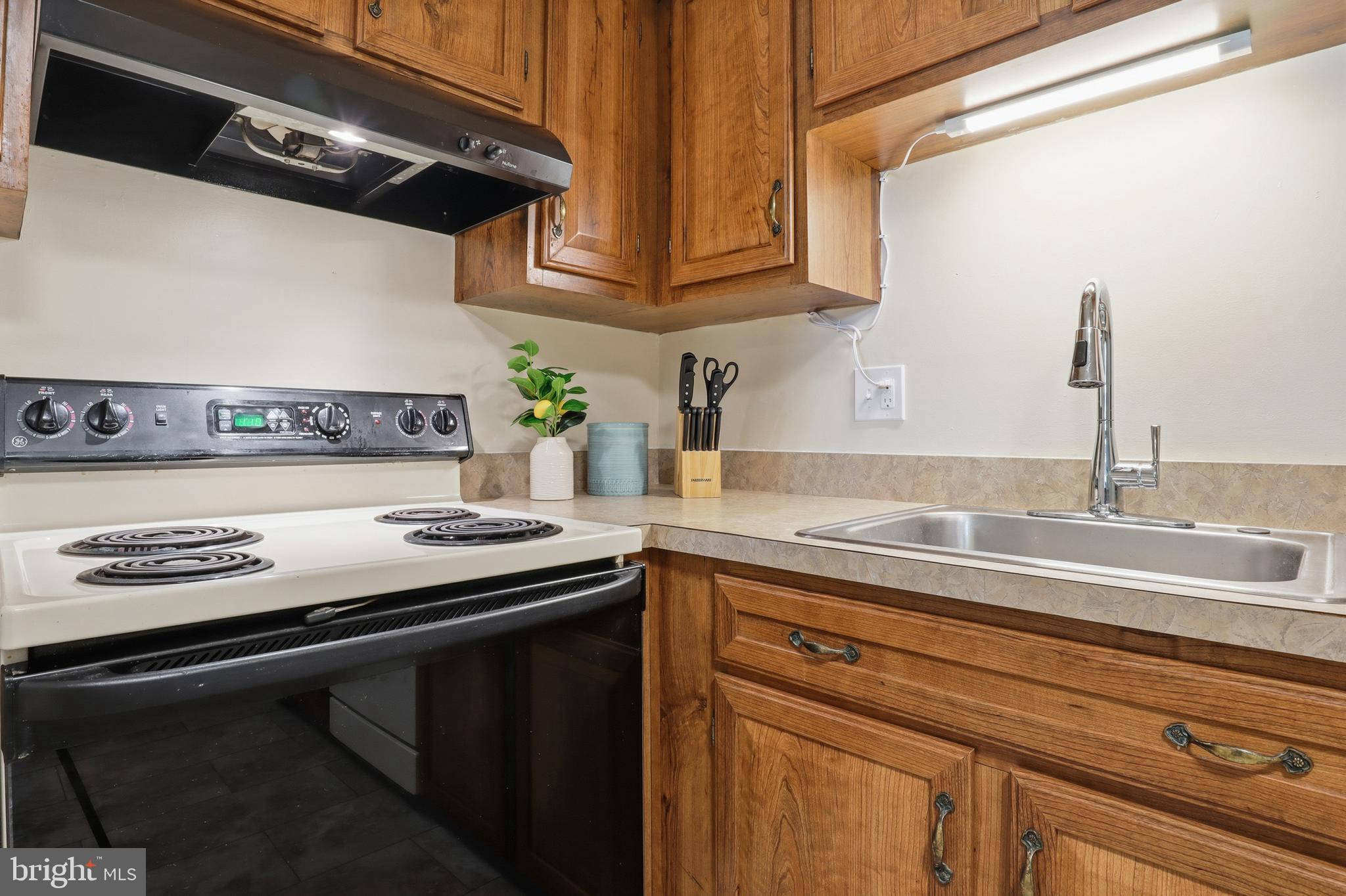 1204 Georgetown Road Middletown, PA 17057 - Photo 12 of 37 a view of a kitchen with stainless steel appliances granite countertop a sink and a stove