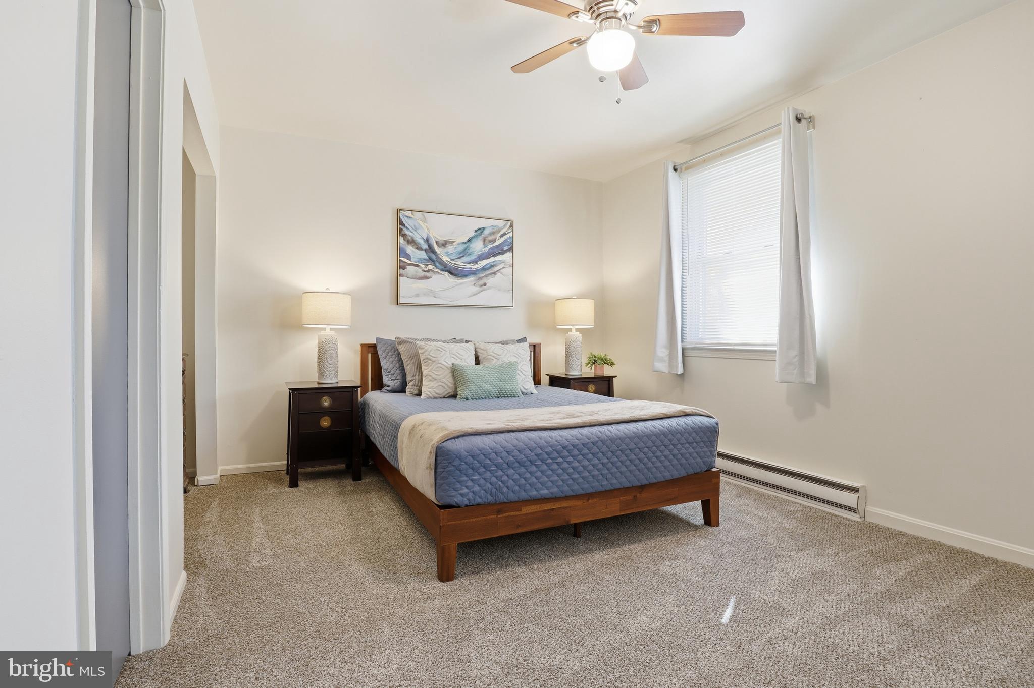 1204 Georgetown Road Middletown, PA 17057 - Photo 22 of 37 a spacious bedroom with a bed and a chandelier