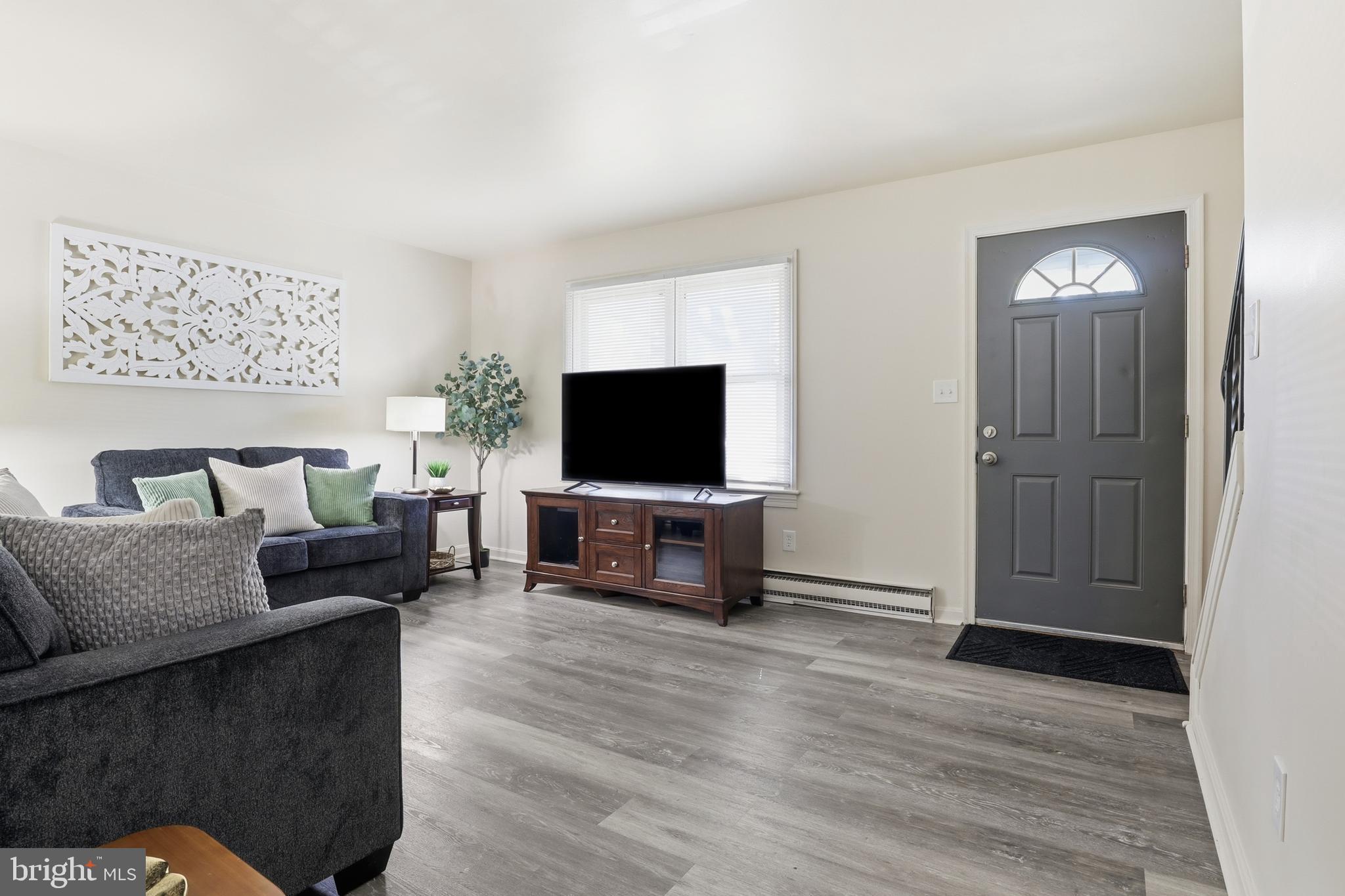 1204 Georgetown Road Middletown, PA 17057 - Photo 6 of 37 a living room with furniture and a flat screen tv