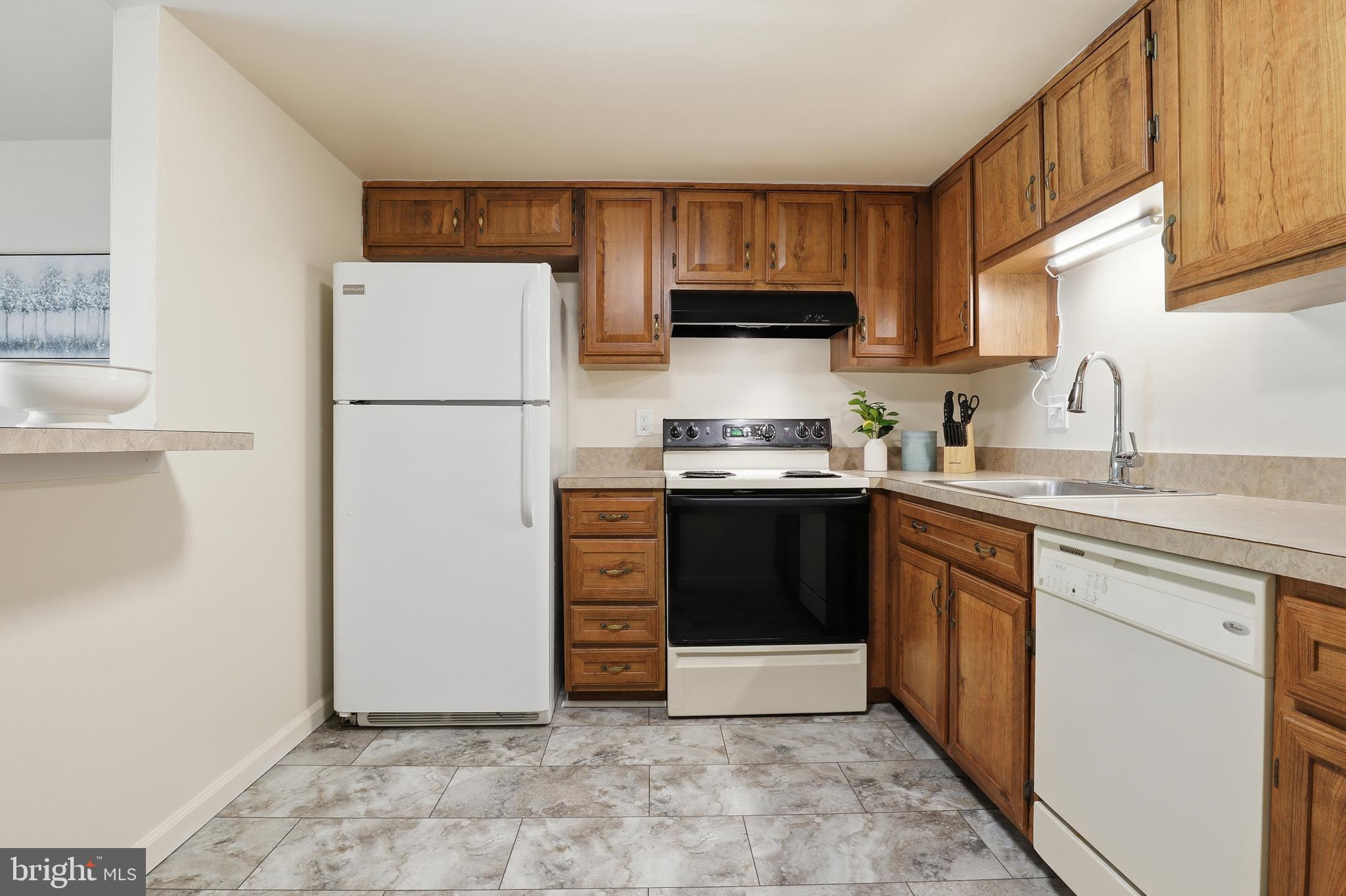 1204 Georgetown Road Middletown, PA 17057 - Photo 10 of 37 a kitchen with a sink a stove and refrigerator