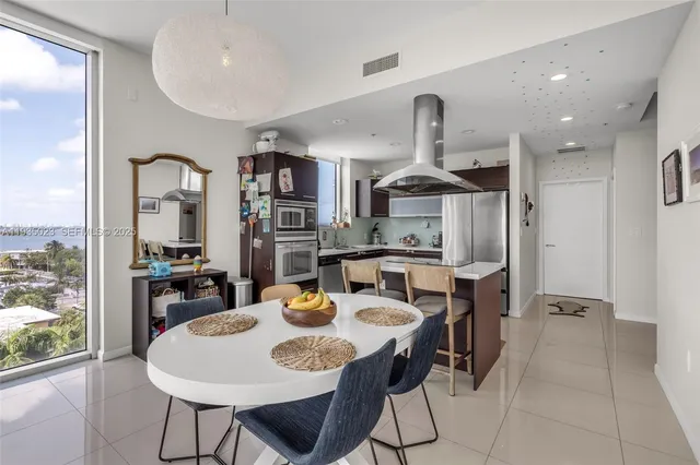 a bedroom with a bed and a lamp with window