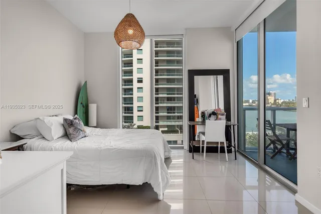 a bathroom with a granite countertop sink toilet a mirror and shower