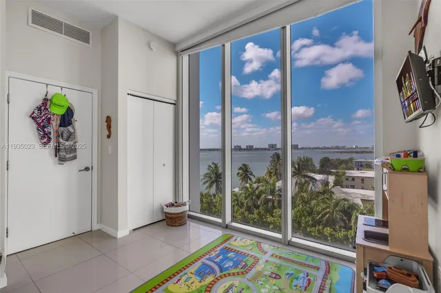 a view of a lake with table and chairs