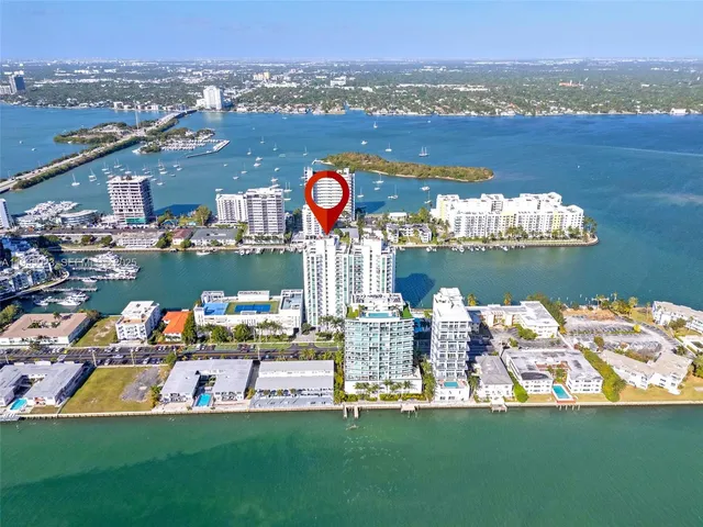 aerial view of a house with a lake view