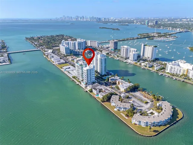 an aerial view of a house with a ocean view