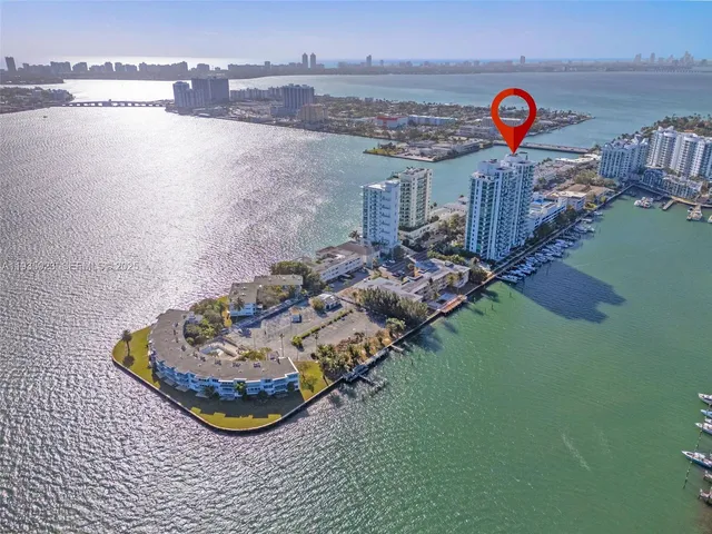 an aerial view of a house with a lake view