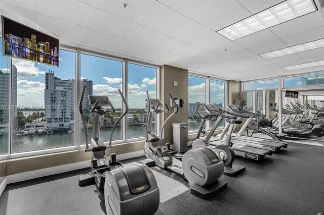 a view of tall building with large windows