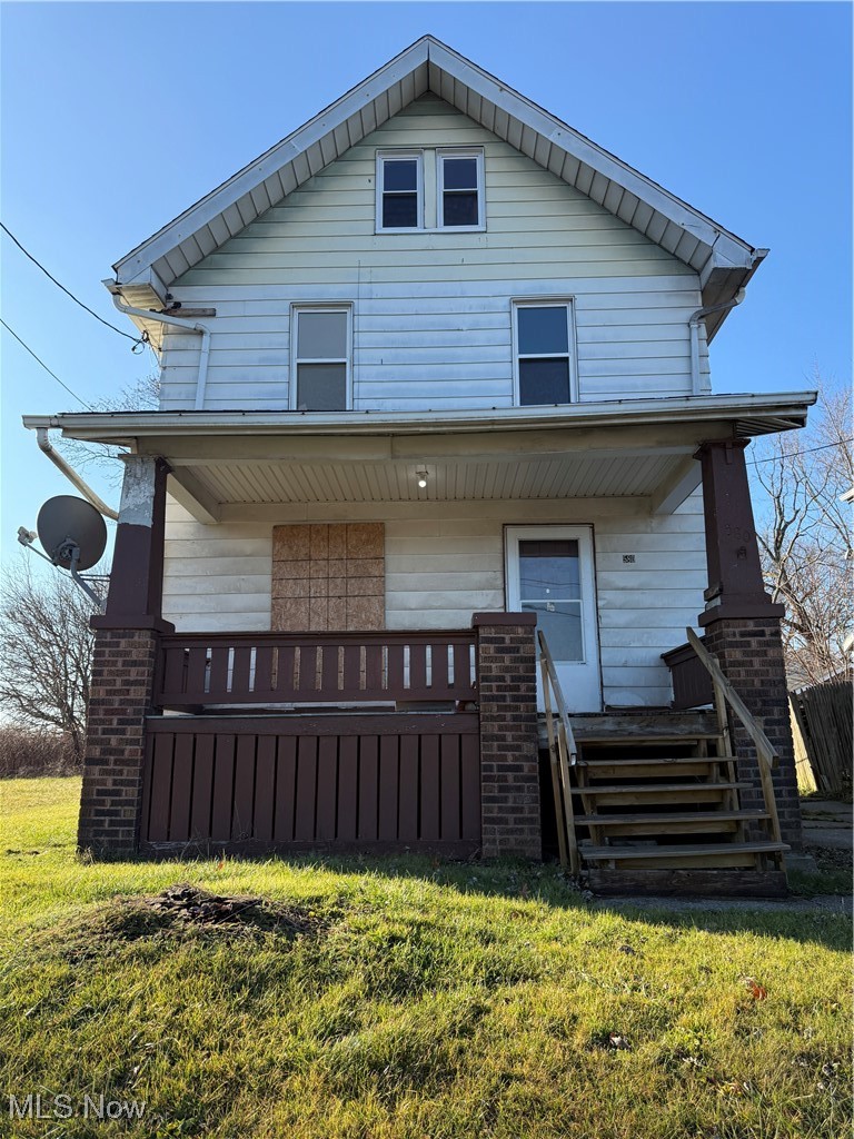 580 Inman Street Akron, OH 44306 - Photo 1 of 12 View of front of home featuring a front lawn and covered porch