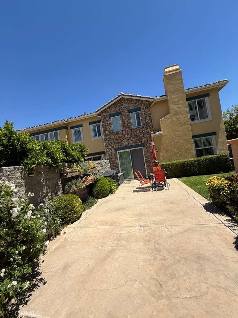 2931 Esperanza Way, Unit B Simi Valley, CA 93063 - Photo 30 of 49 a front view of a house with a yard