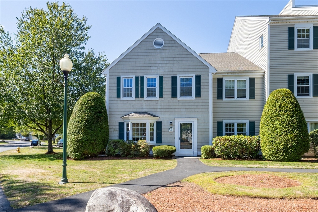 701 Brookside Drive, Unit 701 Andover, MA 01810 - Photo 1 of 4 a front view of a house with a yard