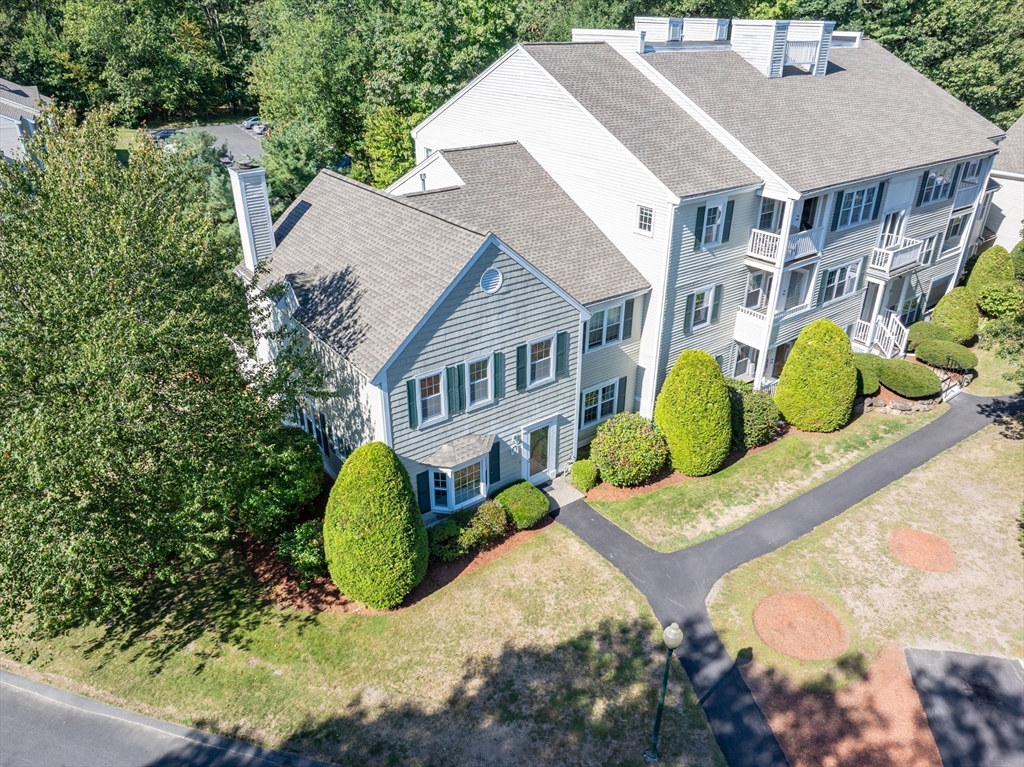 701 Brookside Drive, Unit 701 Andover, MA 01810 - Photo 2 of 4 a aerial view of a house with a yard and potted plants