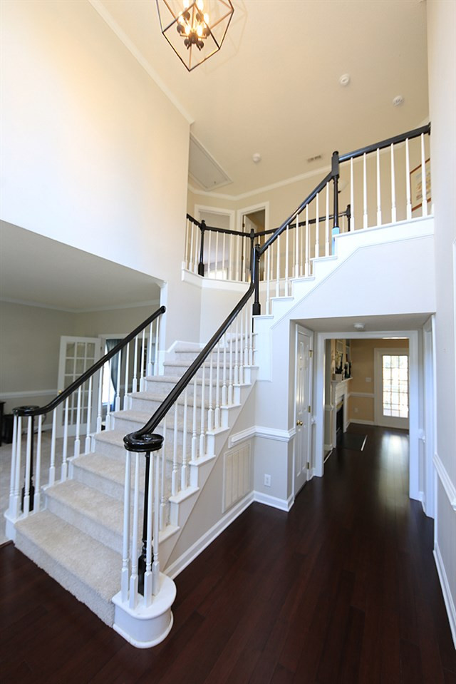 5628 Raddington Street Raleigh, NC 27613 - Photo 3 of 25 Grand two-story entry foyer with hardwood floors. Entryway