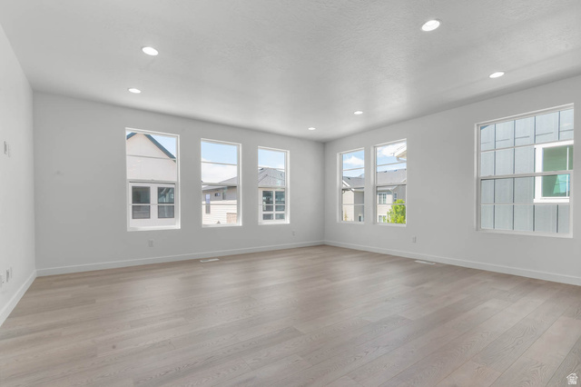 3204 West 1570 North Provo, UT 84601 - Photo 10 of 19 Unfurnished room with light wood finished floors, recessed lighting, and healthy amount of natural light