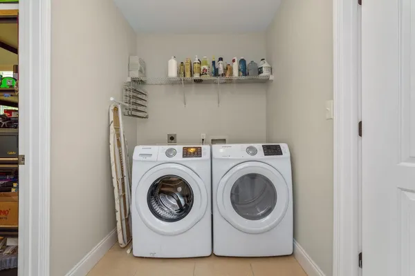 a utility room with dryer and washer