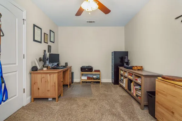 a bedroom with furniture and a window