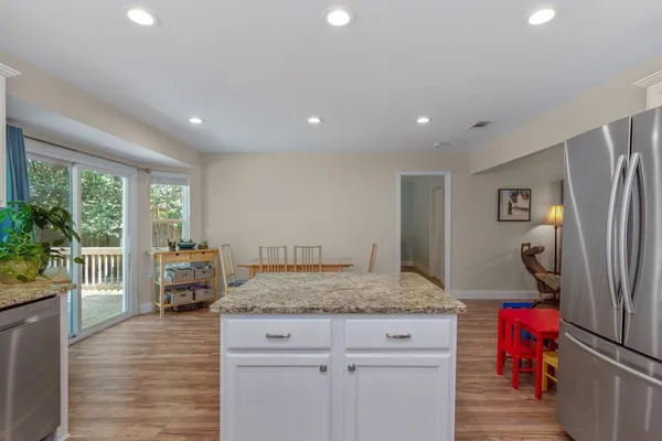 a kitchen with refrigerator and window