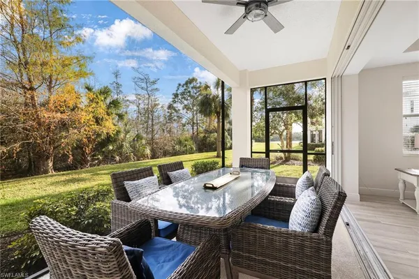 a view of a chair and tables in the garden