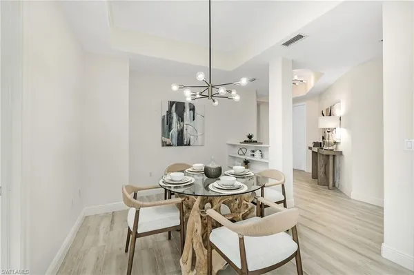 a bedroom with a bed dresser and a window