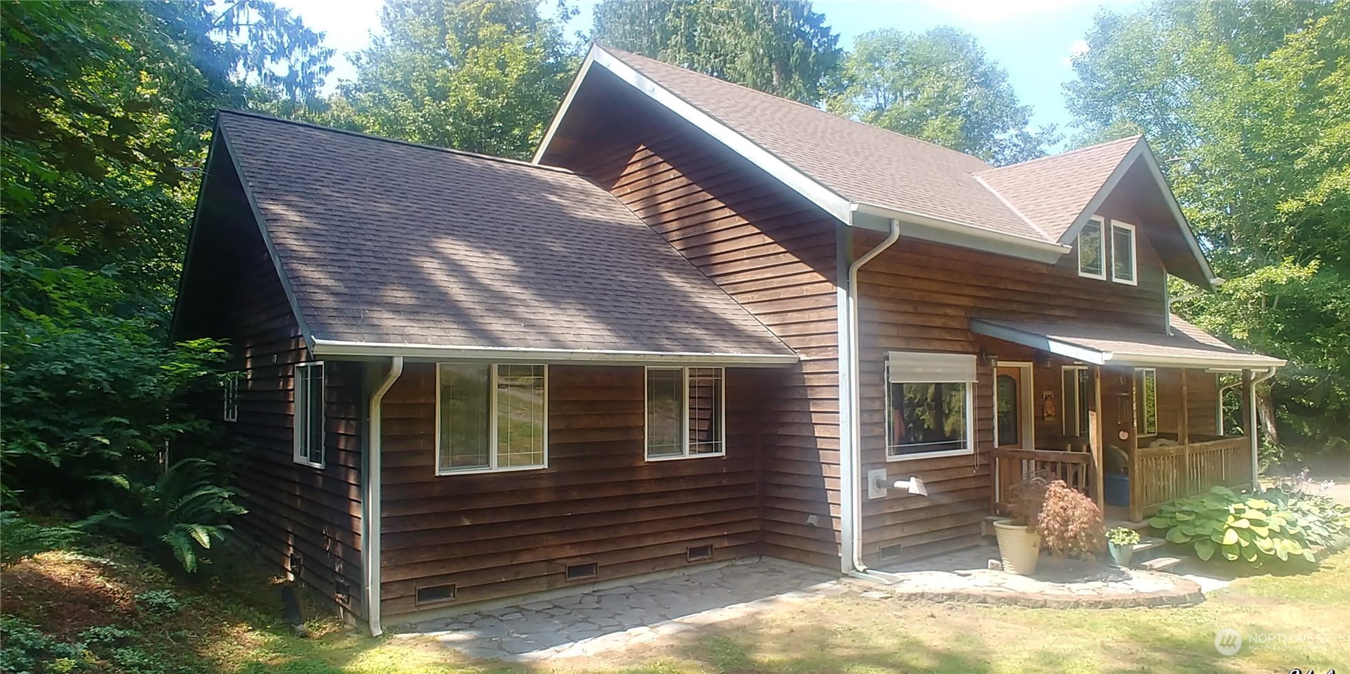 21816 High Rock Road Monroe, WA 98272 - Photo 1 of 1 a view of a house with a yard and floor to ceiling window and wooden fence