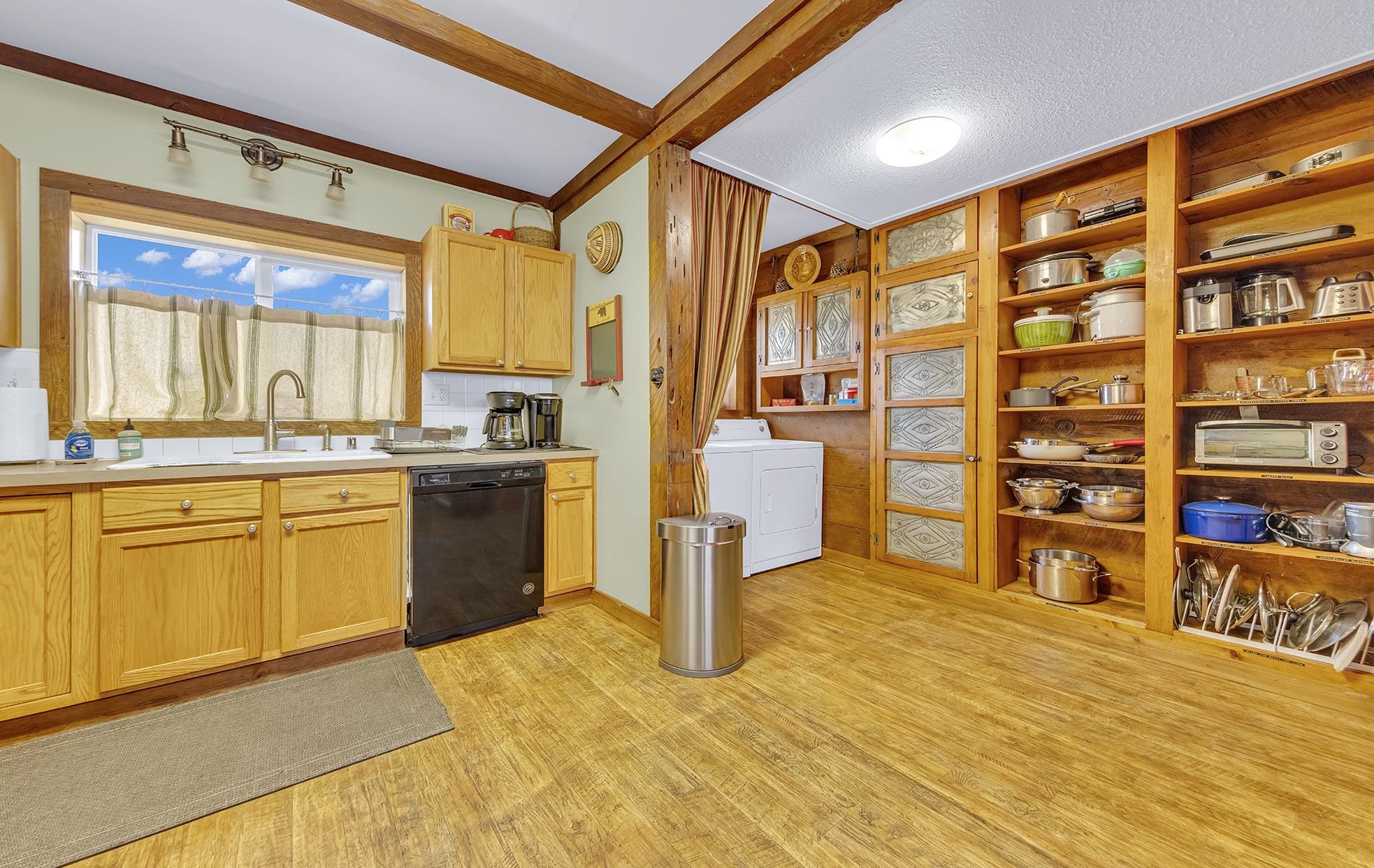 167 Stover Road Chester, CA 96020 - Photo 8 of 33 a kitchen with stainless steel appliances granite countertop a sink cabinets and wooden floor